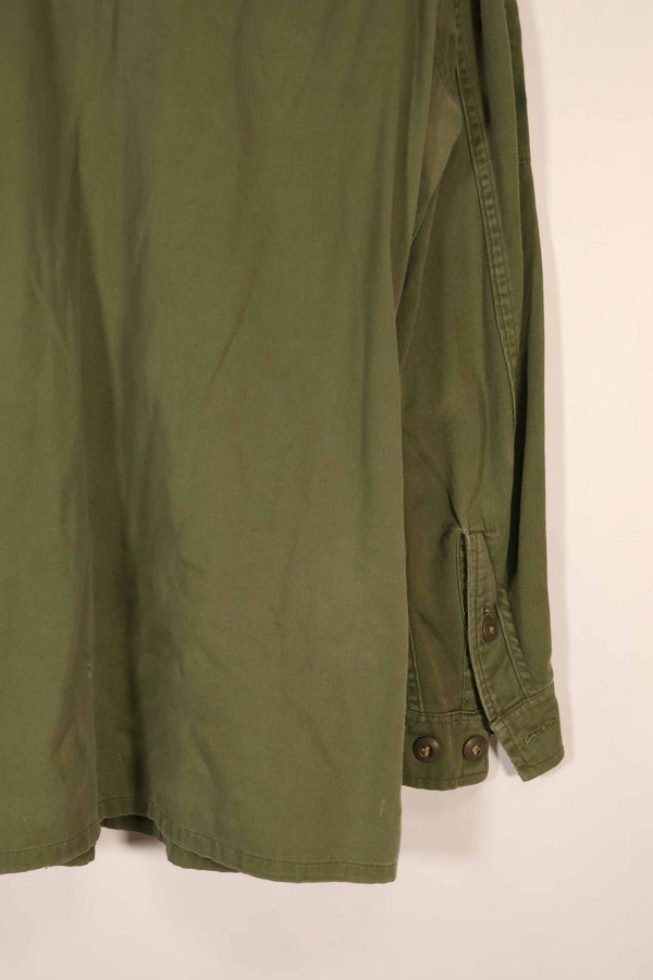 Real 1970 Australian Army OD Fatigue shirt with rank insignia, size unreadable.