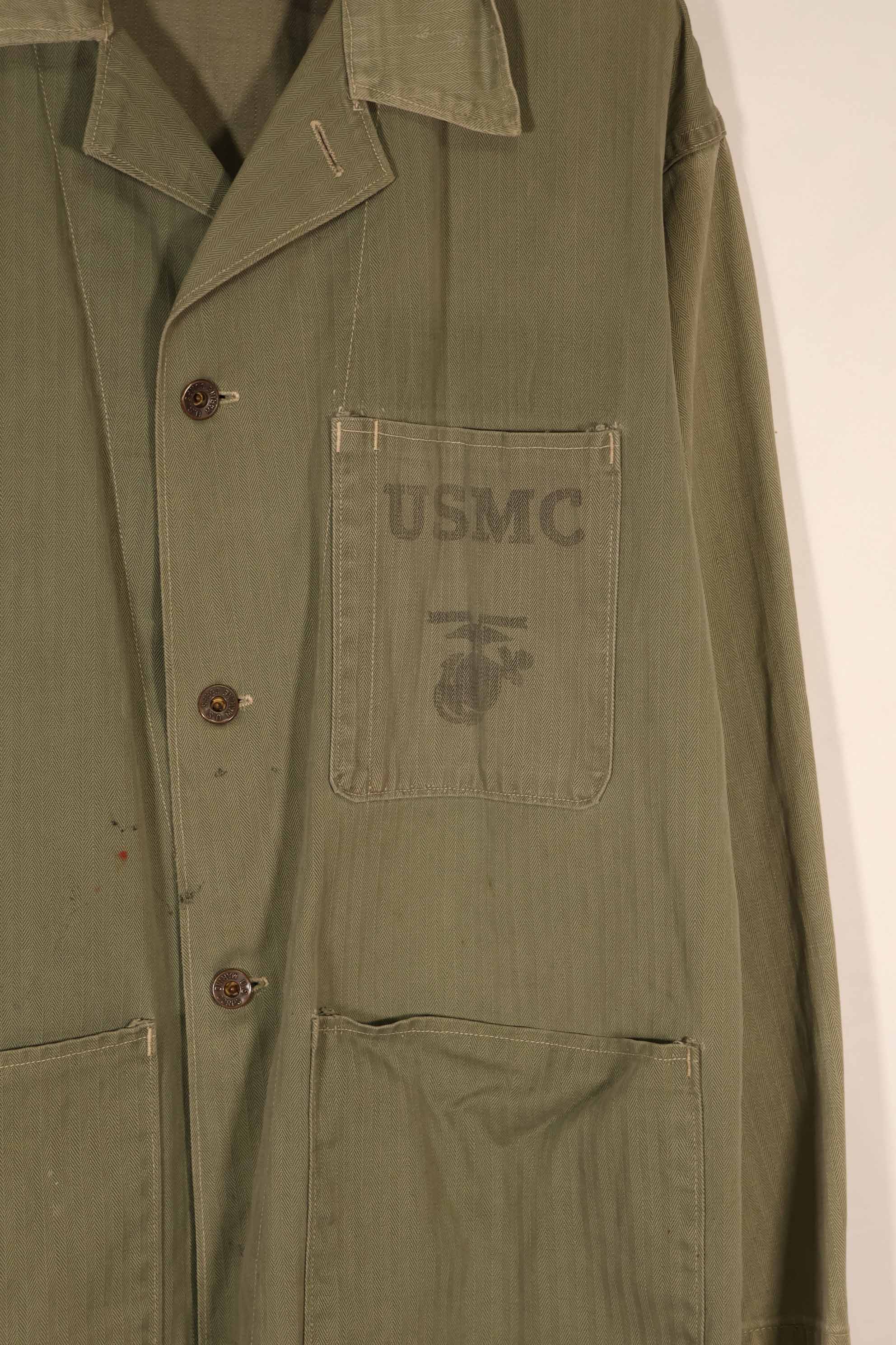 Real 1940s U.S. Marine Corps USMC M41 HBT utility jacket, faded, stained.