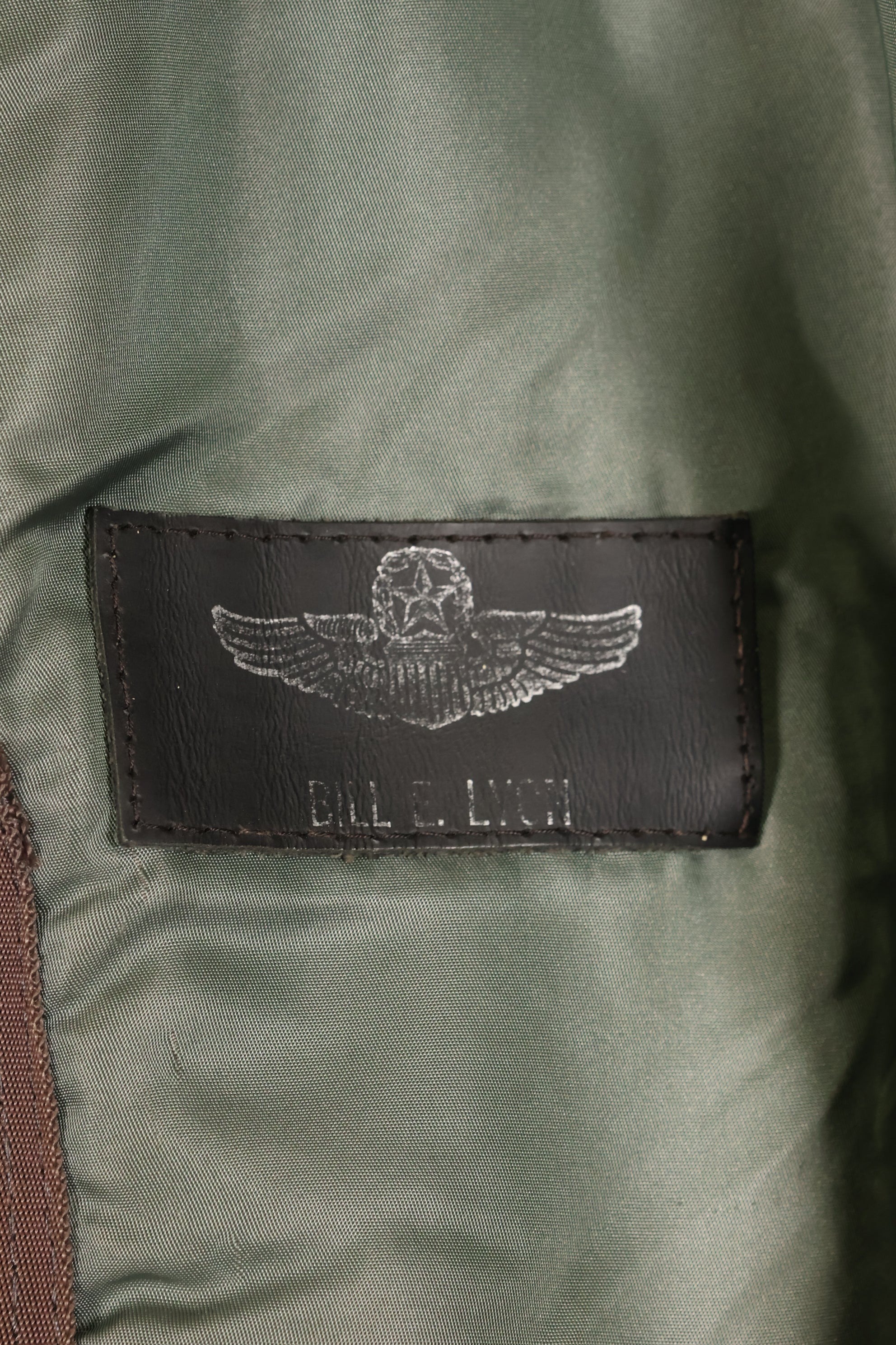 1950s, estimated size 40–42, U.S. Air Force B-15D flight jacket, modified with shearling, includes patches, used