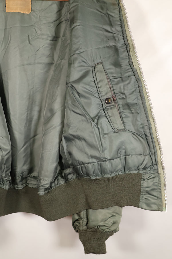 1950s, estimated size 40–42, U.S. Air Force B-15D flight jacket, modified with shearling, includes patches, used
