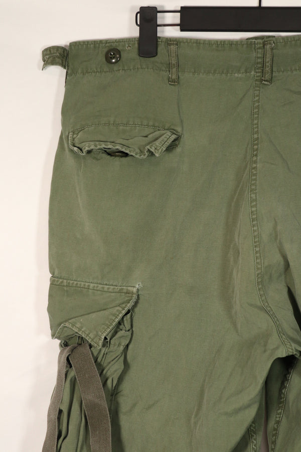 Real 2nd Model Jungle Fatigue Pants with leg ties, large size, stained, used.