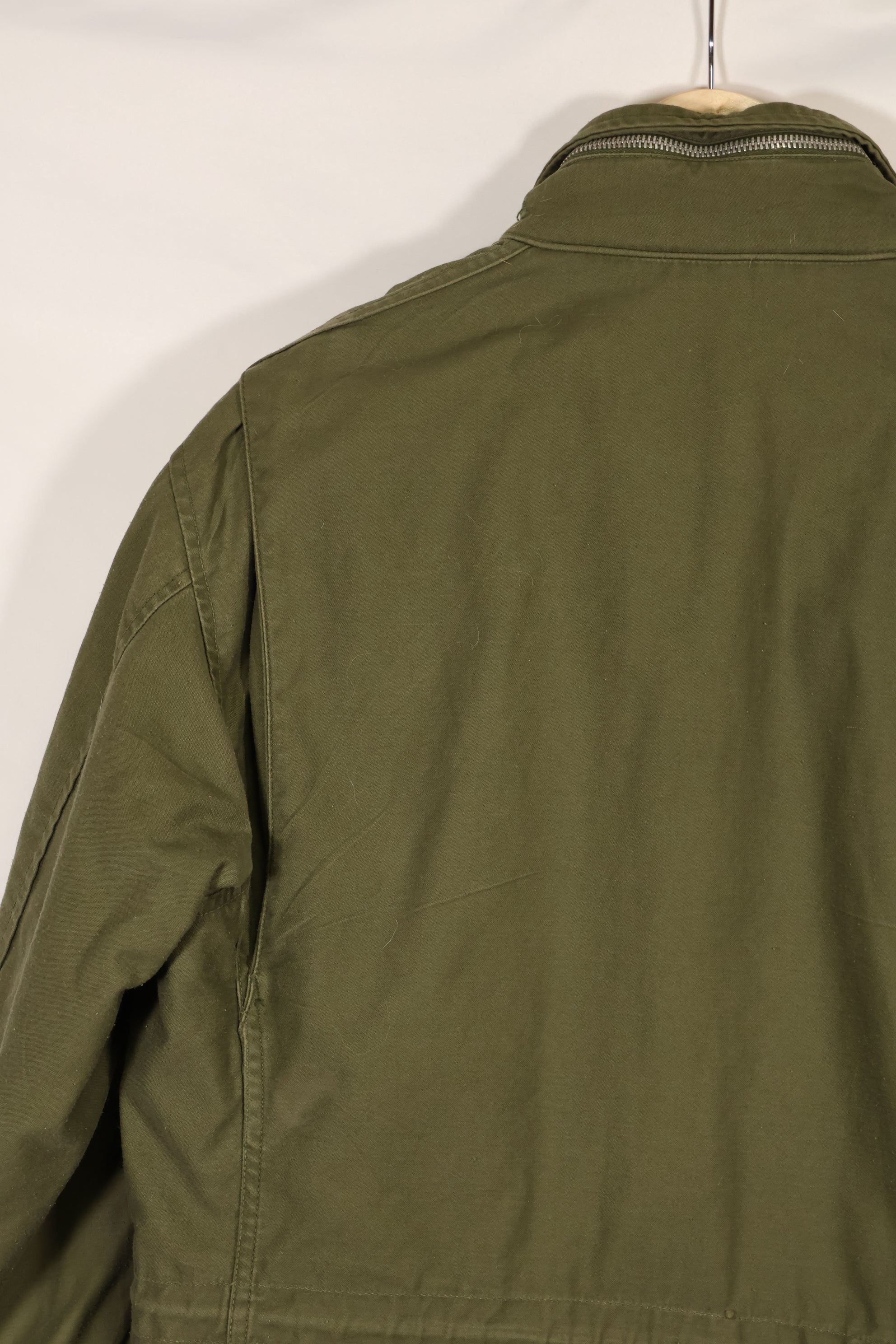 Real owned by former SF member, first model M65 field jacket, estimated 1965-1966, used.