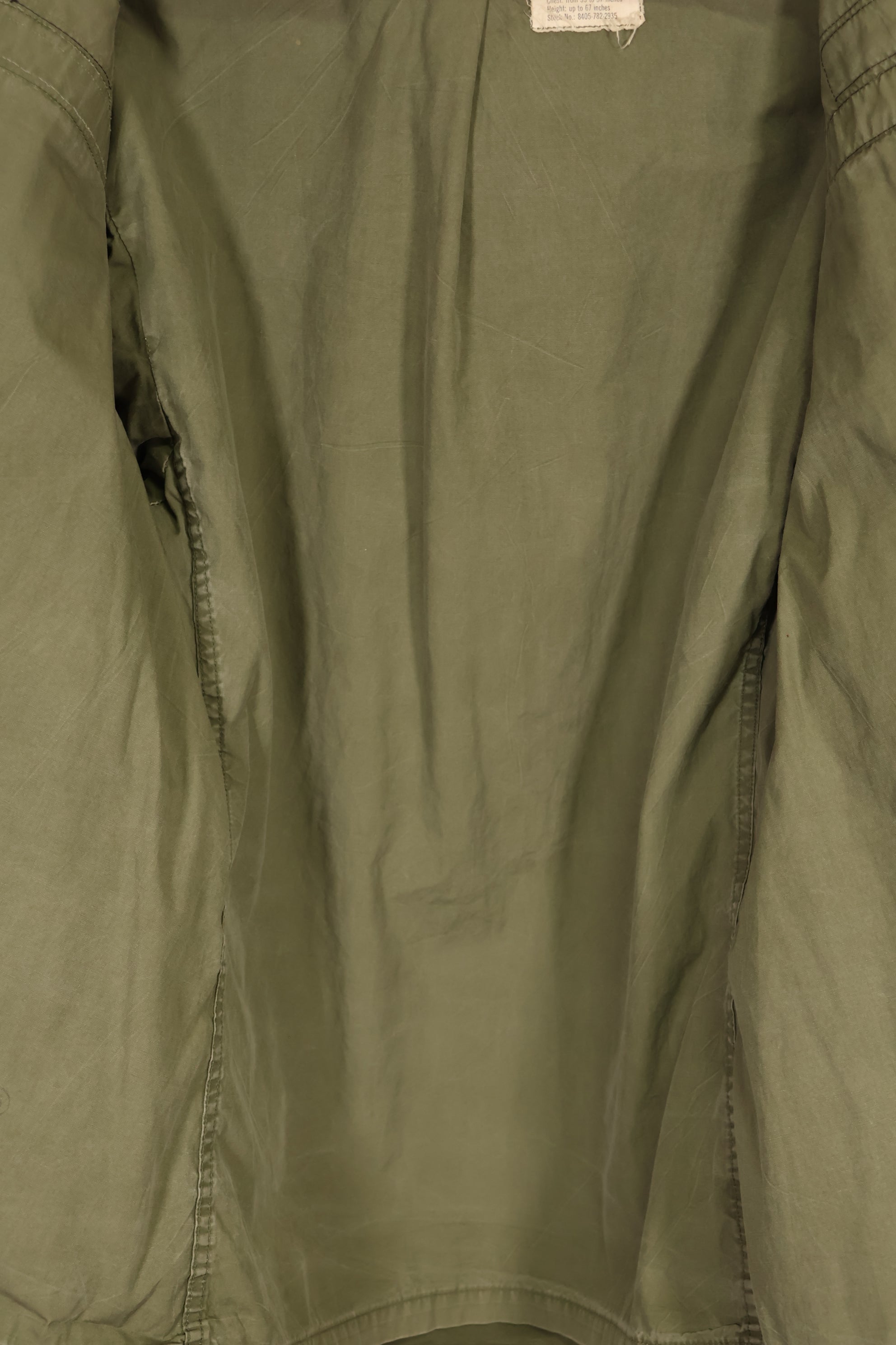 Real owned by former SF member, first model M65 field jacket, estimated 1965-1966, used.