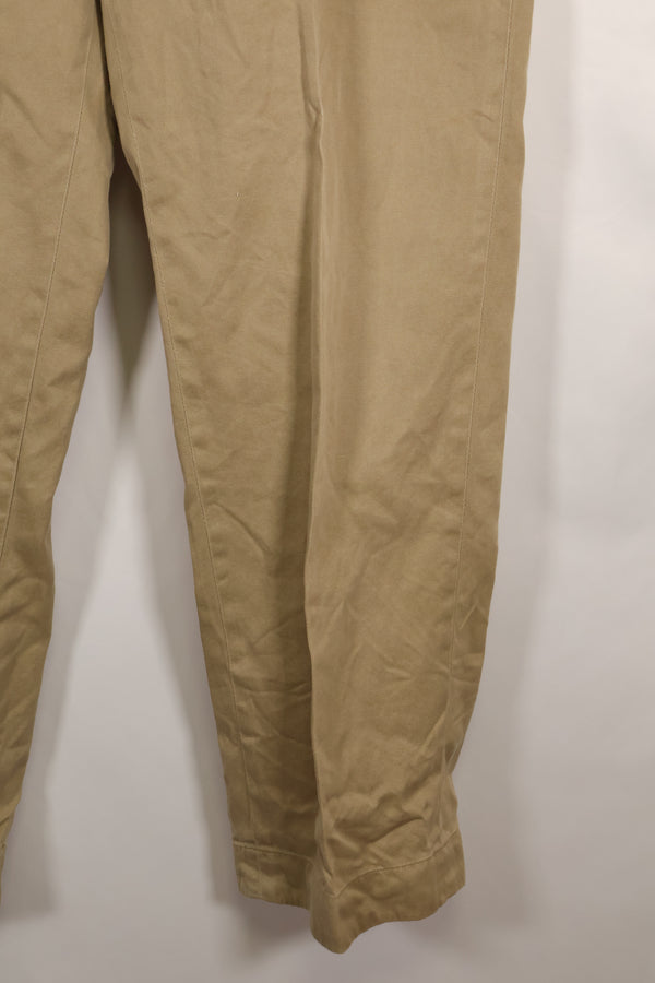 1960s, estimated 34-36 US Army cotton khaki pants, used.