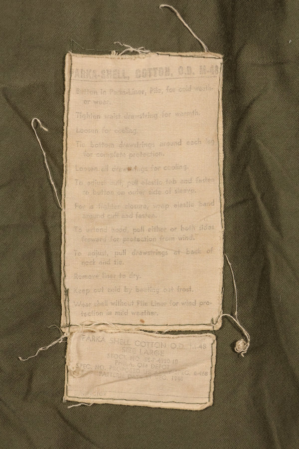 Late 1940's L size US Army M-48 Field Parka with repairs, used movie company costume.