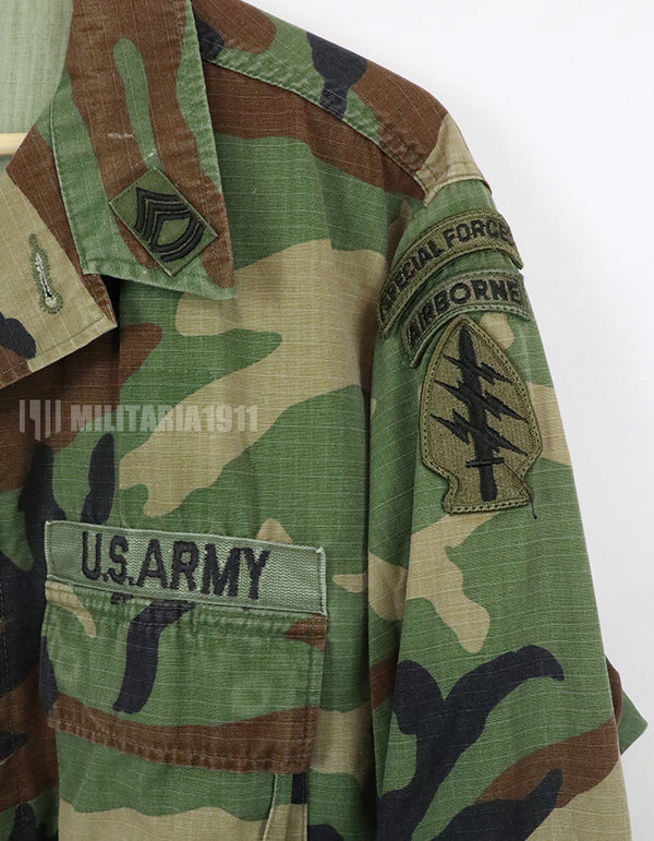 US SURPLUS U.S. Army Special Forces Woodland Camouflage Jacket, 1996, with patches.