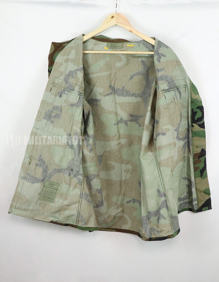 Original U.S. Army Woodland Camouflage Jacket with patches, 1990.